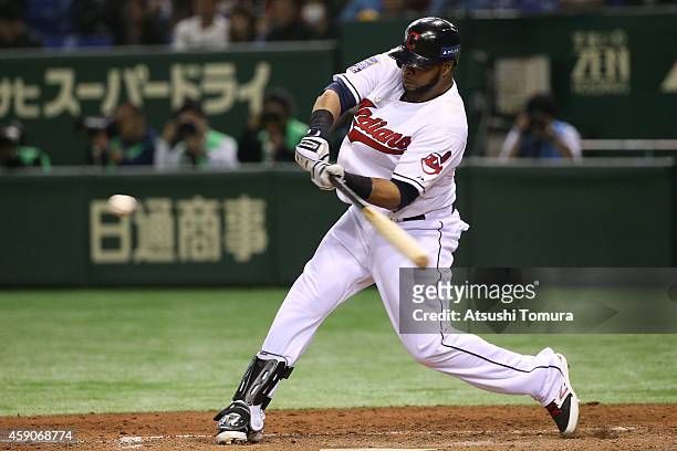 Carlos Santana of the Cleveland Indians hits a single in the eighth inning during the game four of Samurai Japan and MLB All Stars at Tokyo Dome on...