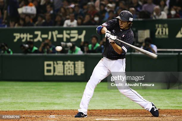 Yuki Yanagita of Samurai Japan hits a single in the eighth inning during the game four of Samurai Japan and MLB All Stars at Tokyo Dome on November...