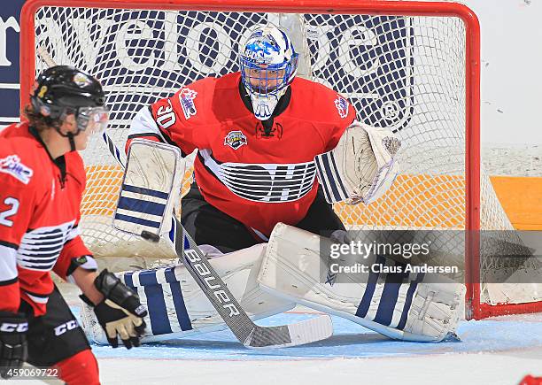 Spencer Martin of Team OHL gets set to face a shot against Team Russia during the 2014 Subway Super Series at the Peterborough Memorial Centre on...