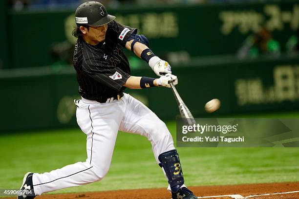 Nobuhiro Matsuda of the Samurai Japan hits a double in the second inning during the game against the MLB All-Stars at the Tokyo Dome during the Japan...