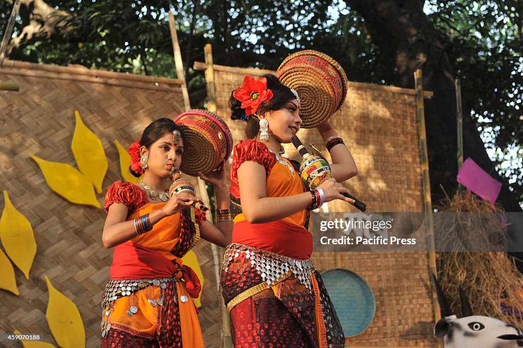 Artists prepare food  during the "Nabanna Festival" in Dhaka...