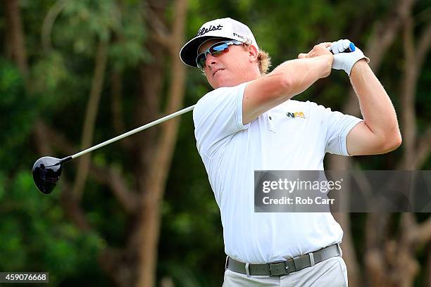 Charley Hoffman of the United States hits a tee shot on the 7th hole during the final round of the OHL Classic at the Mayakoba El Camaleon Golf Club...