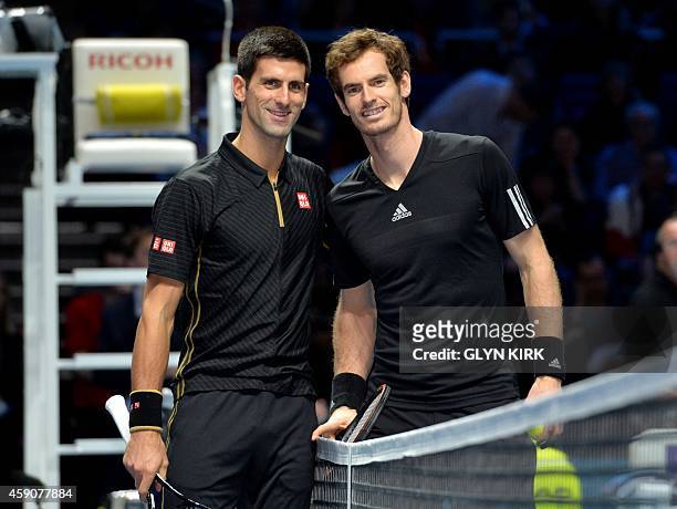Serbia's Novak Djokovic and Britain's Andy Murray pose for pictures ahead of their exhibition match on day eight of the ATP World Tour Finals tennis...