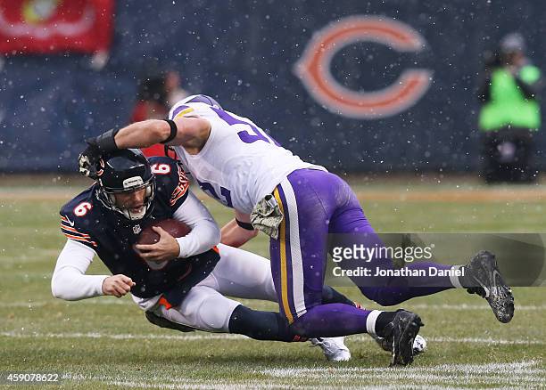 Jay Cutler of the Chicago Bears is tackled by Chad Greenway of the Minnesota Vikings during the second quarter of a game at Soldier Field on November...