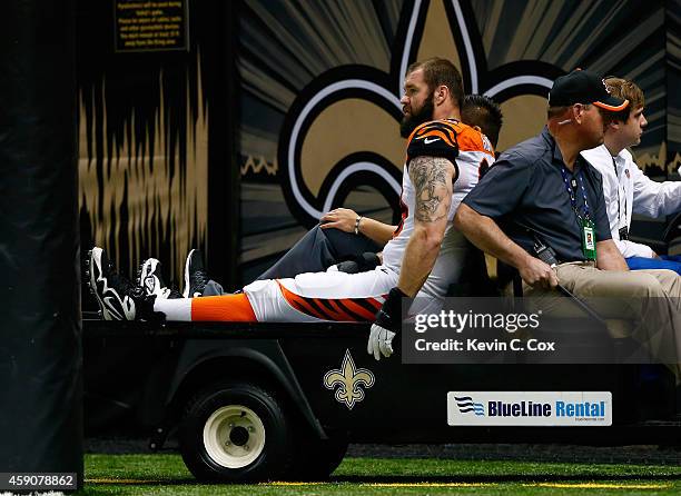 Margus Hunt of the Cincinnati Bengals is carted off the field during the first quarter against the New Orleans Saints at Mercedes-Benz Superdome on...