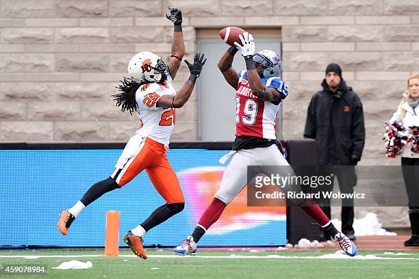 Green of the Montreal Alouettes catches the ball for a touchdown in front of Cord Parks of the BC Lions during the CFL Eastern Division Semi-Final...