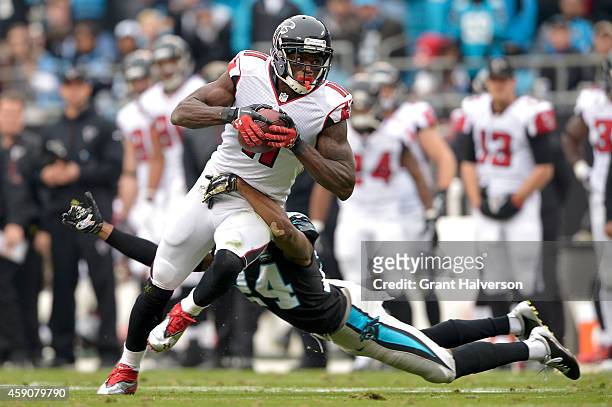 Josh Norman of the Carolina Panthers dives after Julio Jones of the Atlanta Falcons in the 3rd quarter during their game at Bank of America Stadium...