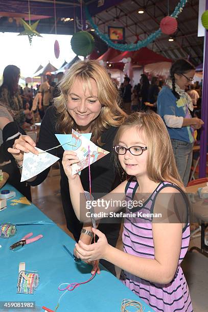 Actress Megyn Price and Grace Price attend P.S. ARTS presents Express Yourself 2014 with sponsors OneWest Bank and Jaguar Land Rover at Barker Hangar...