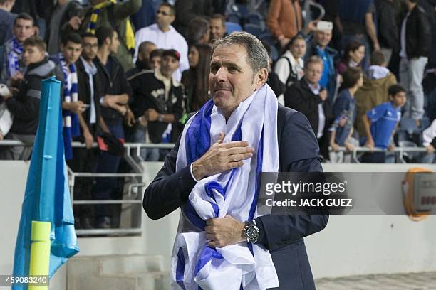 Israel's head coach Elie Guttman celebrates after his team won the UEFA 2016 European Championship qualifying group B football match between Israel...