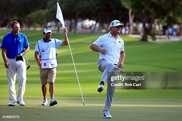 Charley Hoffman of the United States celebrates as Shawn Stefani looks on after putting out on the 18th hole to win the final round of the OHL...