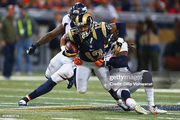 Stedman Bailey of the St. Louis Rams is tackled after making a catch against the Denver Broncos in the fourth quarter at the Edward Jones Dome on...