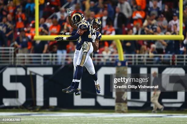 Trumaine Johnson of the St. Louis Rams and T.J. McDonald of the St. Louis Rams celebrate after a turnover in the fourth quarter against the Denver...