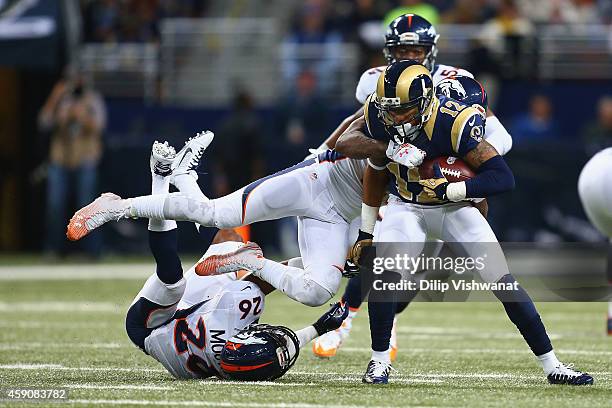 Stedman Bailey of the St. Louis Rams is tackled after making a catch against the Denver Broncos in the second quarter at the Edward Jones Dome on...