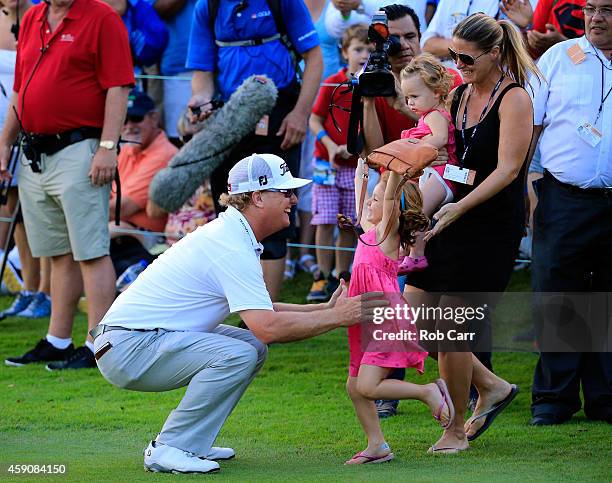 Charley Hoffman of the United States celebrates with his family after putting out on the 18th hole to win the final round of the OHL Classic at the...