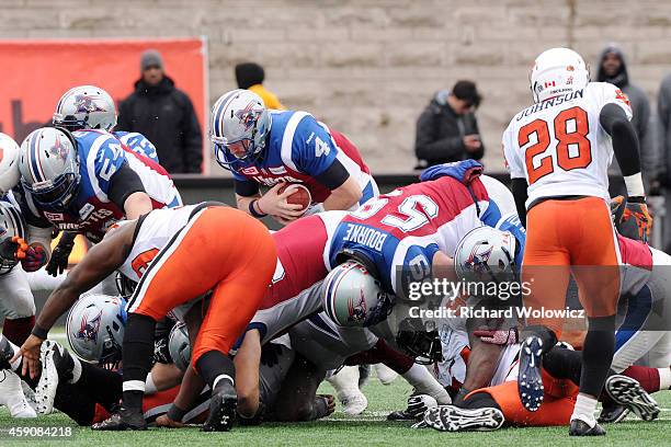 Tanner Marsh of the Montreal Alouettes dives over the line for a first down during the CFL Eastern Division Semi-Final game against the BC Lions at...