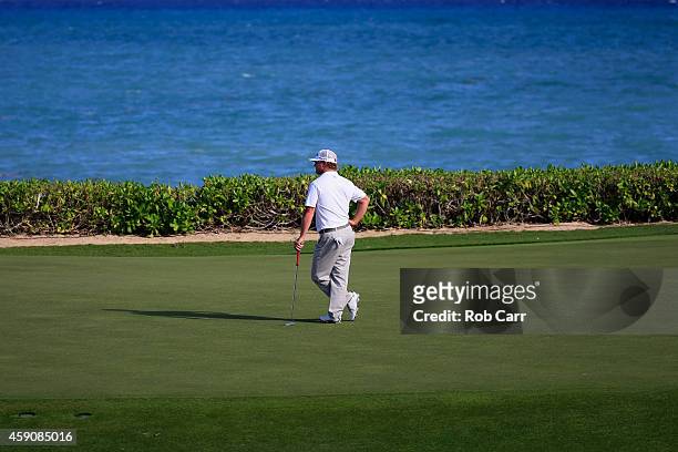 Charley Hoffman of the United States waits to putt on the 15th green during the final round of the OHL Classic at the Mayakoba El Camaleon Golf Club...