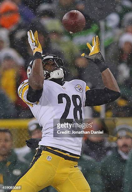 Cortez Allen of the Pittsburgh Steelers intercepts a pass for a touchdown against the Green Bay Packers at Lambeau Field on December 22, 2013 in...