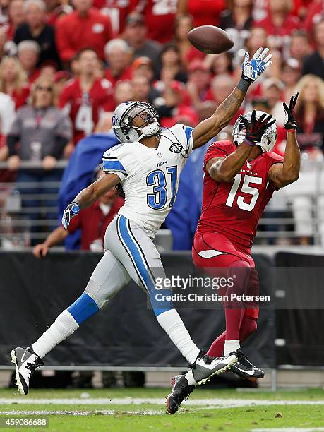 Cornerback Rashean Mathis of the Detroit Lions breaks up a pass intended for wide receiver Michael Floyd of the Arizona Cardinals in the first...