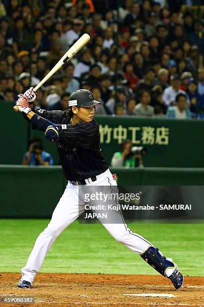 Hayato Sakamoto of Samurai Japan bats during the game four of Samurai Japan and MLB All Stars at Tokyo Dome on November 16, 2014 in Tokyo, Japan.