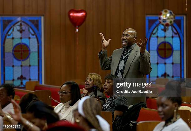 Dwayne Martin and other parishioners attend a service at the St. John Missionary Baptist Church which was celebrating its 48th anniversary as they...