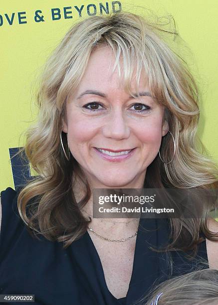 Actress Megyn Price attends P.S. ARTS Express Yourself 2014 at the Barker Hanger on November 16, 2014 in Santa Monica, California.
