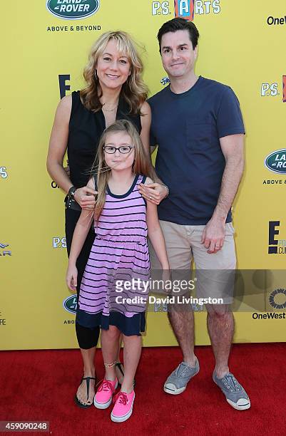 Actress Megyn Price, Grace Price and Dr. Edward Cotner attend P.S. ARTS Express Yourself 2014 at the Barker Hanger on November 16, 2014 in Santa...