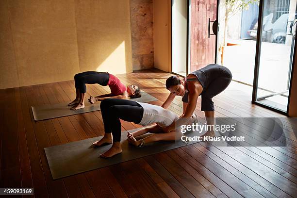 yoga session, setu bandha sarvangasana,bridge pose - setu bandha sarvangasana stock pictures, royalty-free photos & images