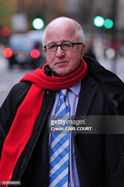 Former British Labour Party MP Denis MacShane arrives at the Old Bailey court in central London on December 23, 2013 for sentencing after pleading...