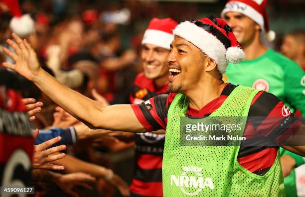 Shinji Ono of the Wanderes celebrates with fans after winning the round 11 A-League match between the Western Sydney Wanderers and the Central Coast...