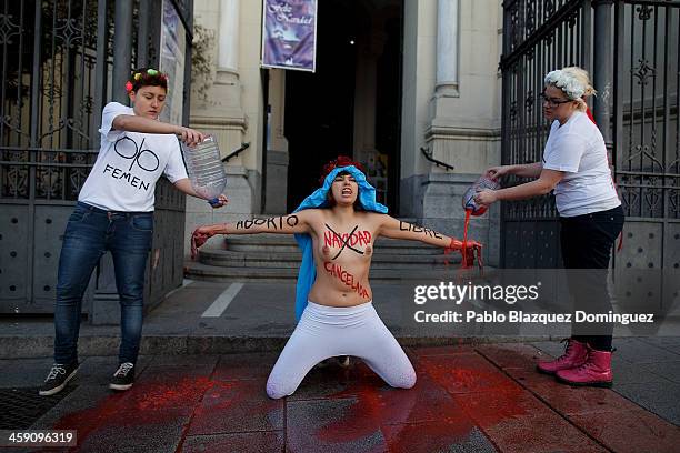 Members of the FEMEN activist group protest outside San Manuel y San Benito church in Madrid against the Spanish Government plan to cut women's right...