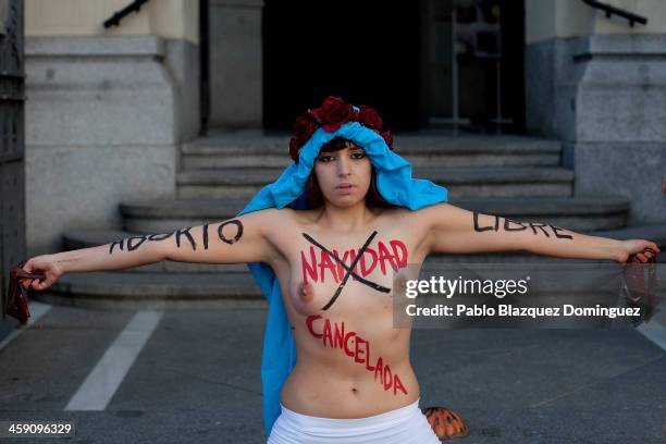 Member of the FEMEN activist group protest outside San Manuel y San Benito church in Madrid against the Spanish Government plan to cut women's right...