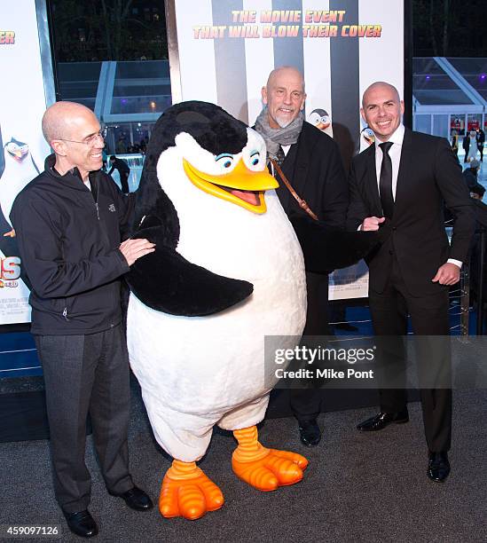 Deamworks Animation CEO Jeffrey Katzenberg, John Malkovich and Pitbull attend the "Penguins Of Madagascar" New York Premiere at Winter Village at...