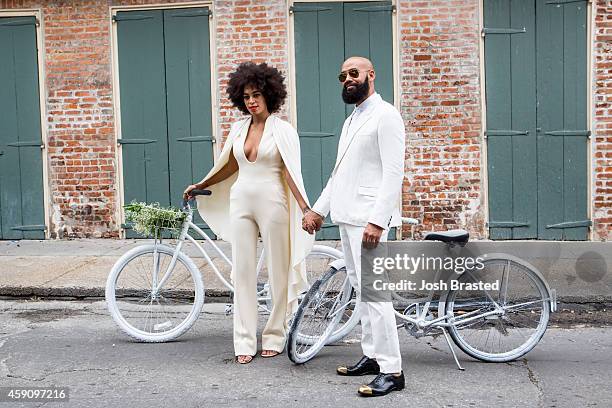 Musician Solange Knowles and her fiance, music video director Alan Ferguson, ride bicycles on the streets of the French Quarter en route to their...