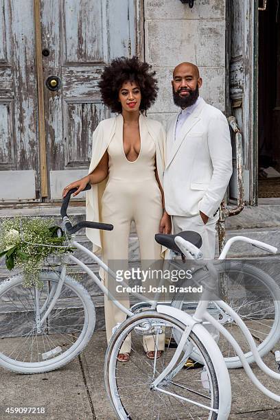 Musician Solange Knowles and her fiance, music video director Alan Ferguson, ride bicycles on the streets of the French Quarter en route to their...