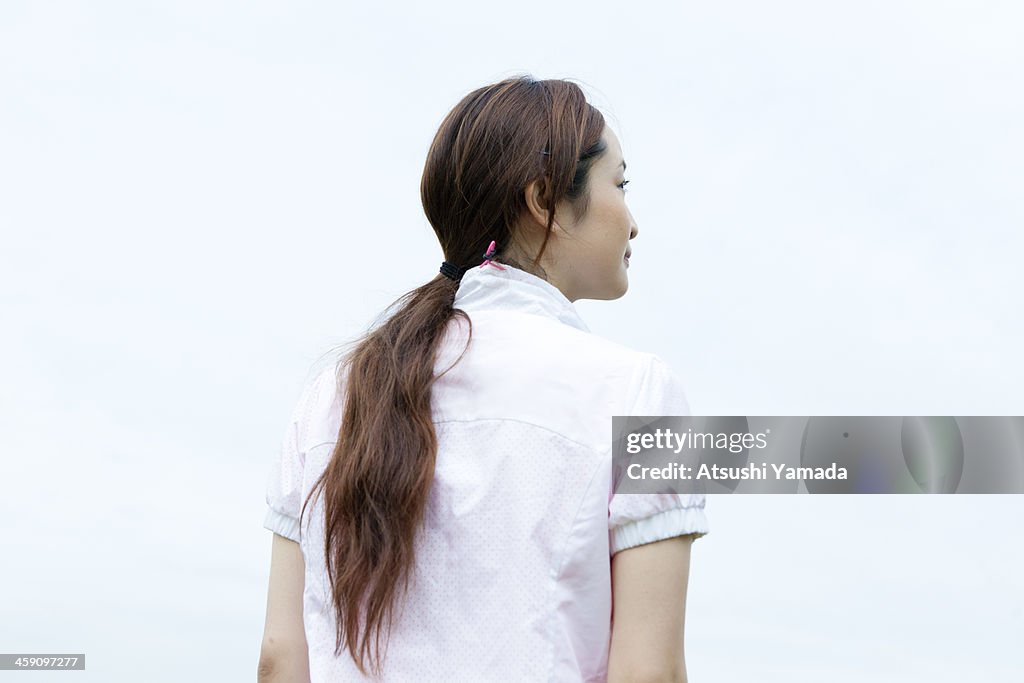 Rear view of young woman wearing jogging clothes