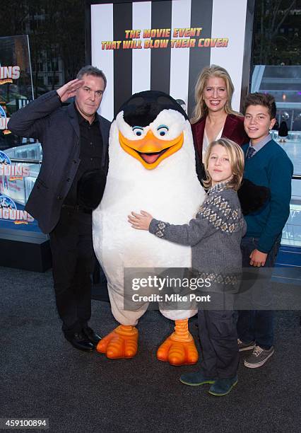 Chris Miller and family attend the "Penguins Of Madagascar" New York Premiere at Winter Village at Bryant Park Ice Rink on November 16, 2014 in New...
