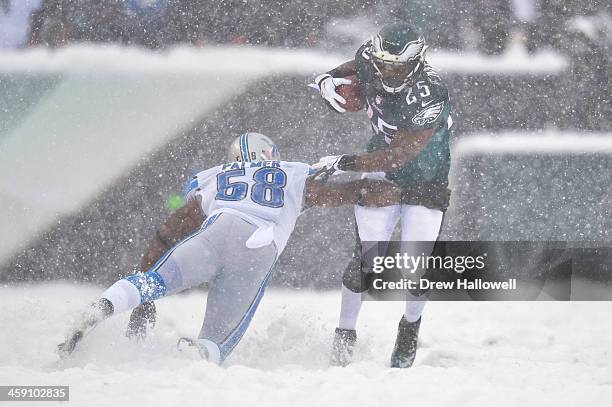 LeSean McCoy of the Philadelphia Eagles avoids Ashlee Palmer of the Detroit Lions at Lincoln Financial Field on December 8, 2013 in Philadelphia,...