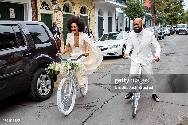 Musician Solange Knowles and her fiance, music video director Alan Ferguson, ride bicycles on the streets of the French Quarter en route to their...