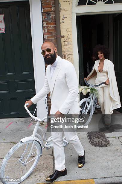Musician Solange Knowles and her fiance, music video director Alan Ferguson, ride bicycles on the streets of the French Quarter en route to their...