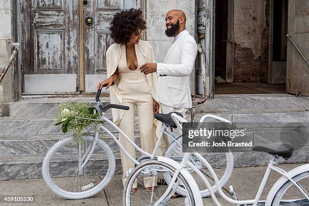 Musician Solange Knowles and her fiancee, music video director Alan Ferguson ride bicycles on the streets of the French Quarter en route to their...