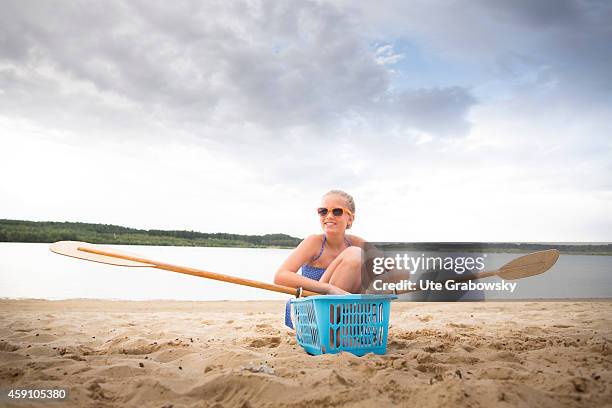 Twelve-year-old girl sitting in a self-built canoe on August 11 in Duelmen, Germany. Photo by Ute Grabowsky/Photothek via Getty Images)