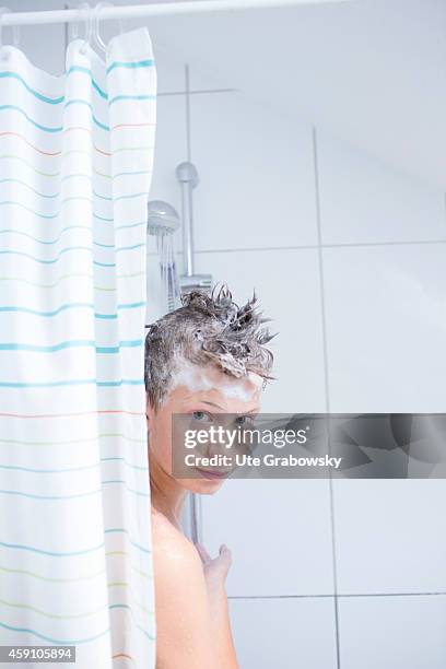 Fourteen-year-old boy with shampoo in his hair under the shower on August 12 in Duelmen, Germany. Photo by Ute Grabowsky/Photothek via Getty Images)