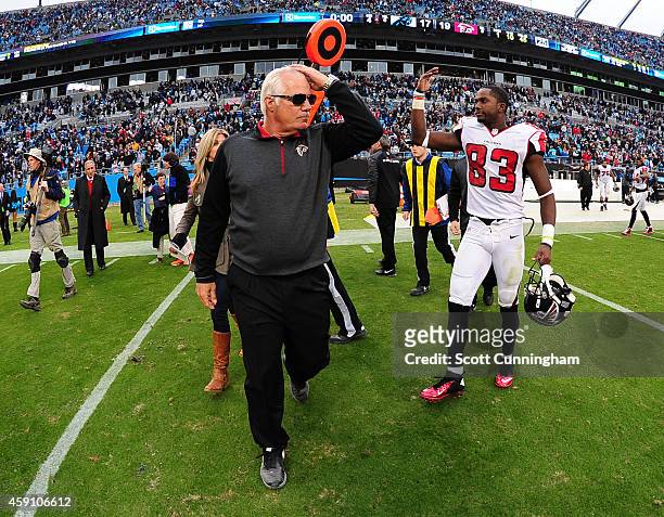 Head Coach Mike Smith of the Atlanta Falcons heads off the field after defeating the Carolina Panthers at Bank Of America Stadium on November 16,...