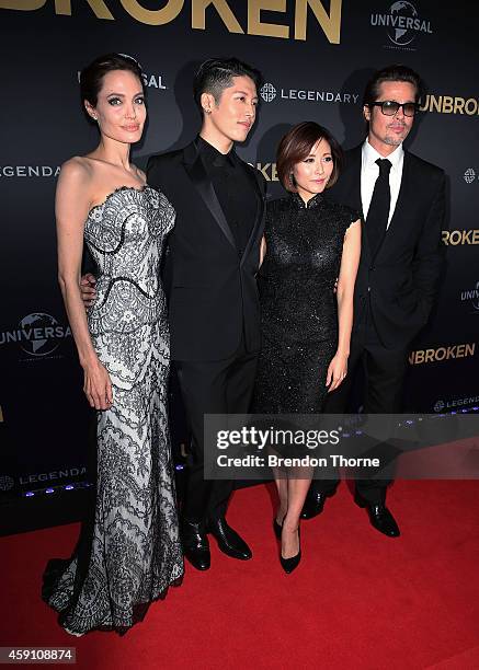 Angelina Jolie, Melody Ishihara, Miyavi Ishihara and Brad Pitt arrive at the world premiere of Unbroken at the State Theatre on November 17, 2014 in...