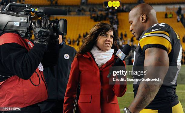 Sports Sunday Night Football sideline reporter Michele Tafoya interviews linebacker James Harrison of the Pittsburgh Steelers after a game against...