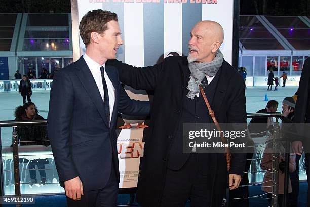 Actors Benedict Cumberbatch and John Malkovich attend the "Penguins Of Madagascar" New York Premiere at Winter Village at Bryant Park Ice Rink on...