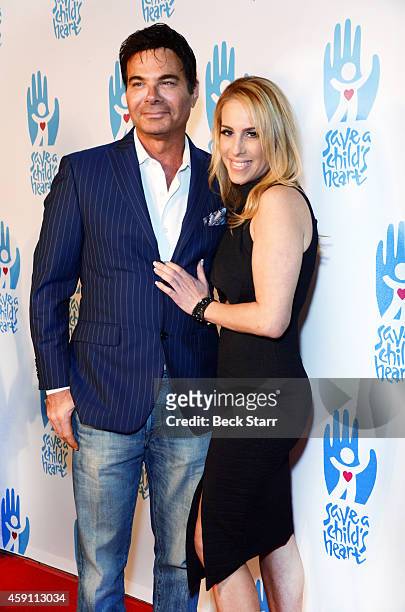 Eric Schiffer and TV personality Dr. Jenn Berman arrive at Save A Child's Heart Celebration & Honorary Ceremony at Sony Studios on November 16, 2014...