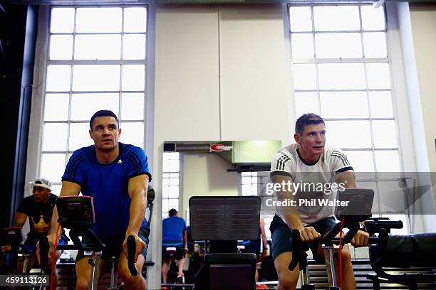 Dan Carter and Colin Slade of the All Blacks warm up during a New Zealand All Blacks Gym session at the Cardiff University Strength and Conditioning...