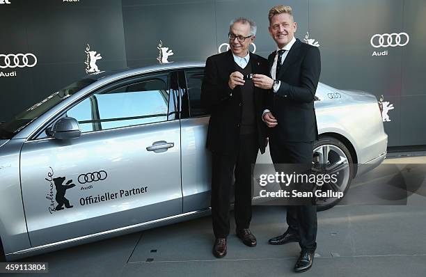 Dieter Kosslick , Director of the Berlinale International Film Festival symobolically receives a key to an Audi limousine from Wayne Griffiths,...