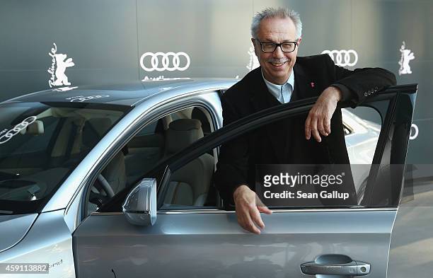 Dieter Kosslick, Director of the Berlinale International Film Festival, poses in front of an Audi limousine at Audi City Berlin on November 18, 2013...